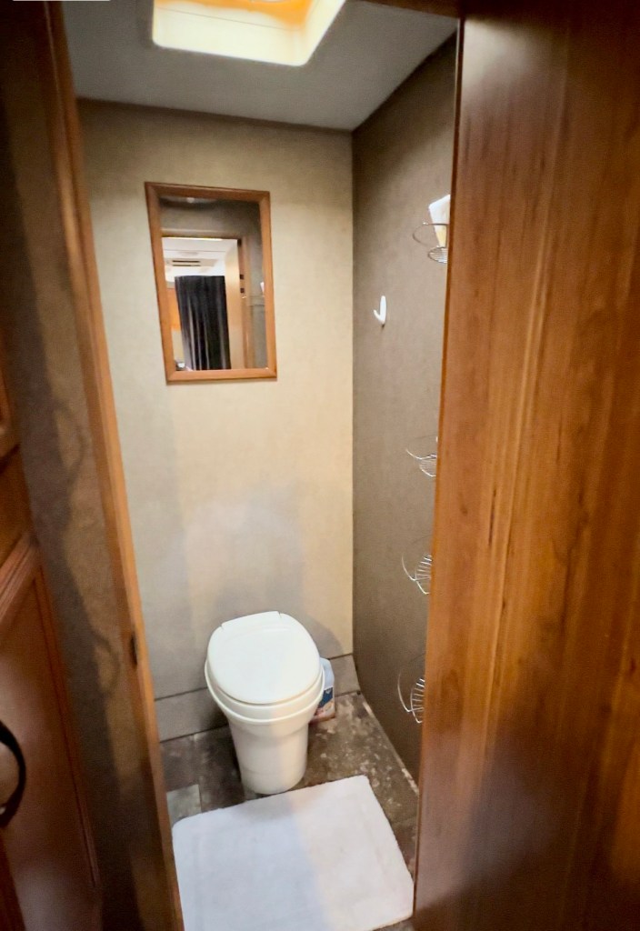 Bathroom with shower inside our 21’ Bunkhouse rental from RV Share at the Campsites at Disney's Fort Wilderness Resort