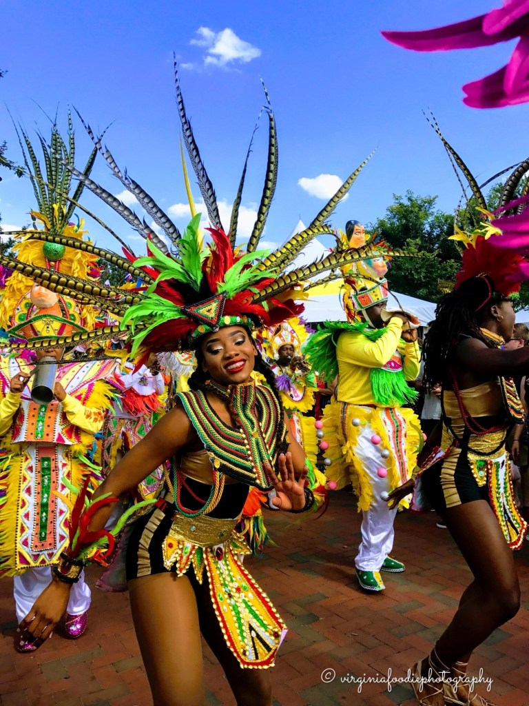 harbor festival norfolk virginia woman in Bahamaian dress dances for the crowds