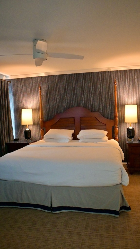 king size bed inside the King Vista suite at the Tides Inn in Irvington, Virginia