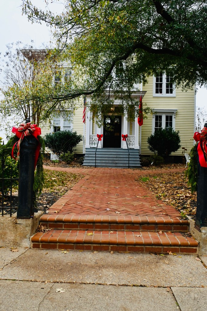 Beautiful colonial home in Fredericksburg, Virginia decorated with red bows