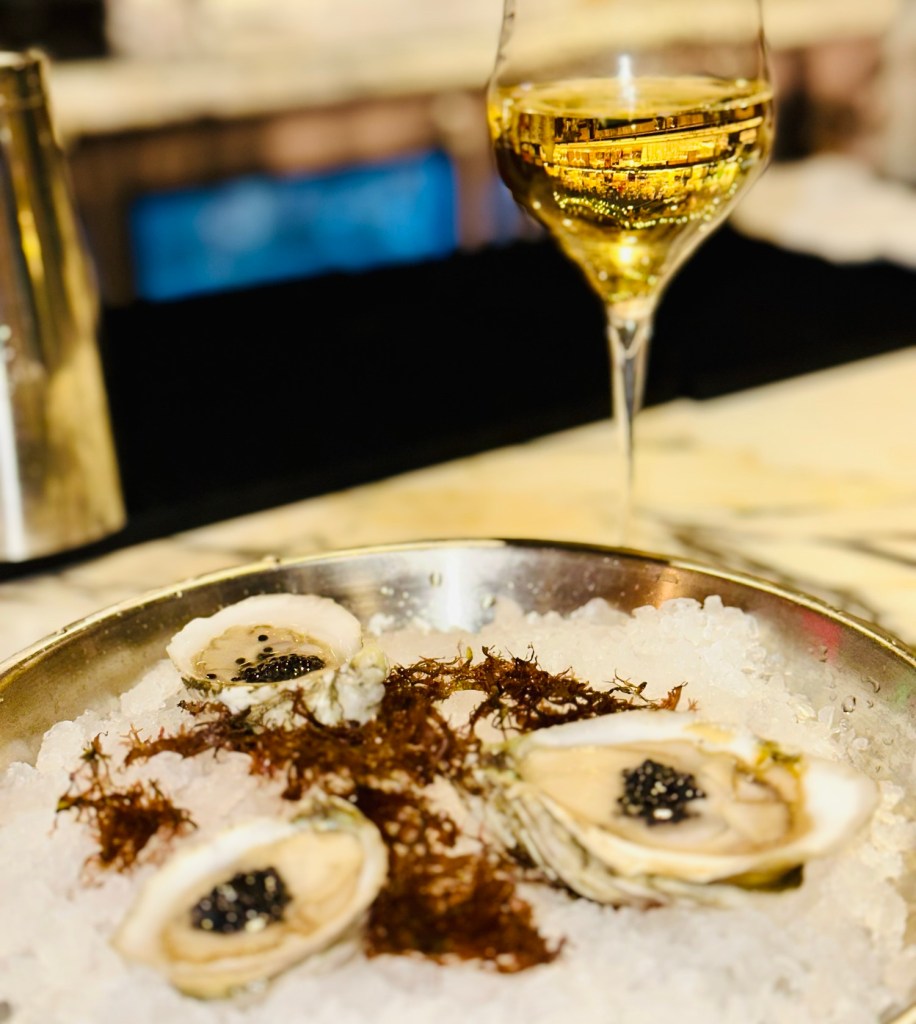 caviar, top oysters, and a glass of Moet champagne at the view room