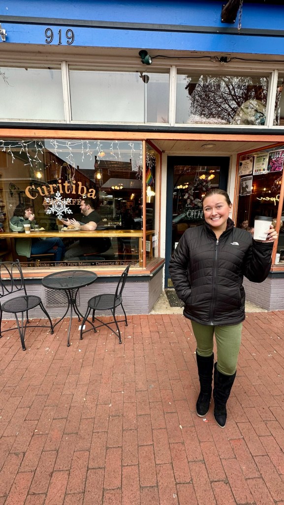 thevirginiahypegirl stands infront of Curitiba coffe shop Downtown Fredericksburg, Virginia