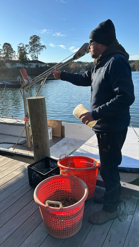 captain Smiley explains oysters on the ecology and horticulture tour